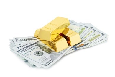 Shiny gold bars and dollar bills on white background