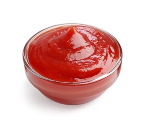 Photo of Tasty ketchup in glass bowl isolated on white. Tomato sauce