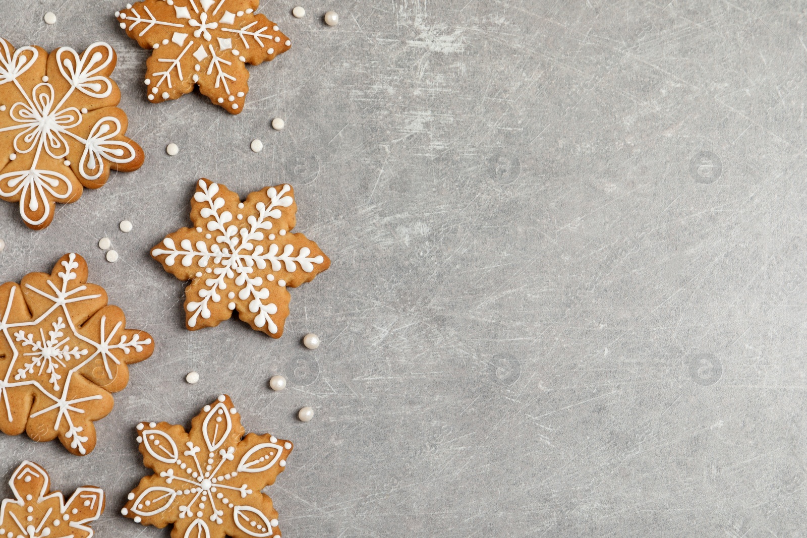 Photo of Tasty Christmas cookies on light grey table, flat lay. Space for text