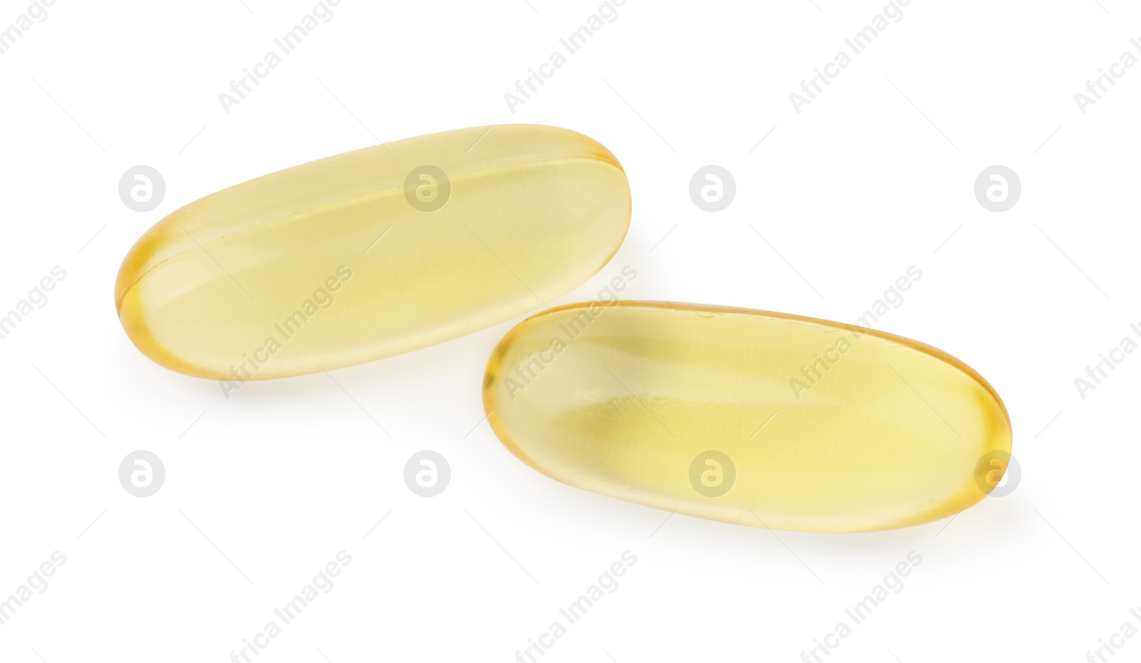 Photo of Yellow vitamin capsules isolated on white, top view