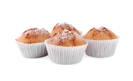 Tasty muffins powdered with sugar on white background