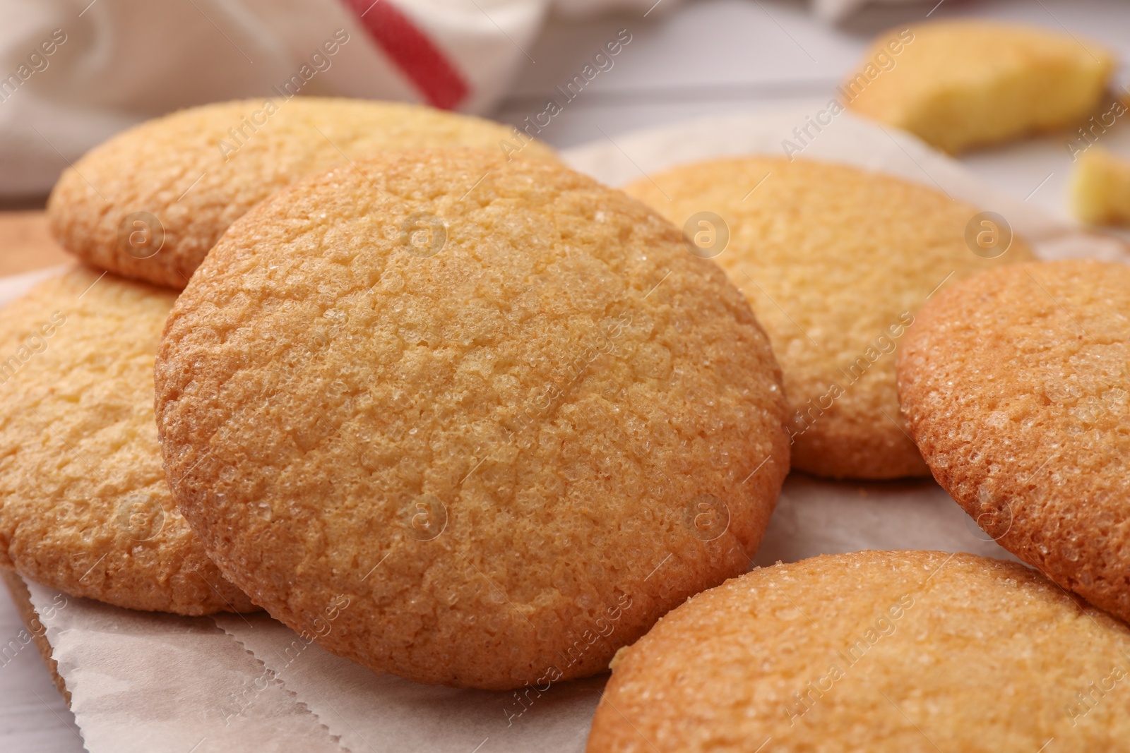 Photo of Delicious Danish butter cookies on wooden board, closeup