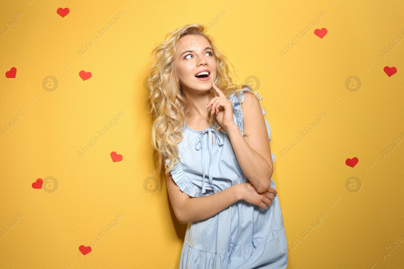 Photo of Emotional stylish young woman on color background