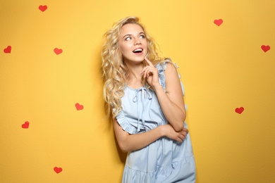 Photo of Emotional stylish young woman on color background