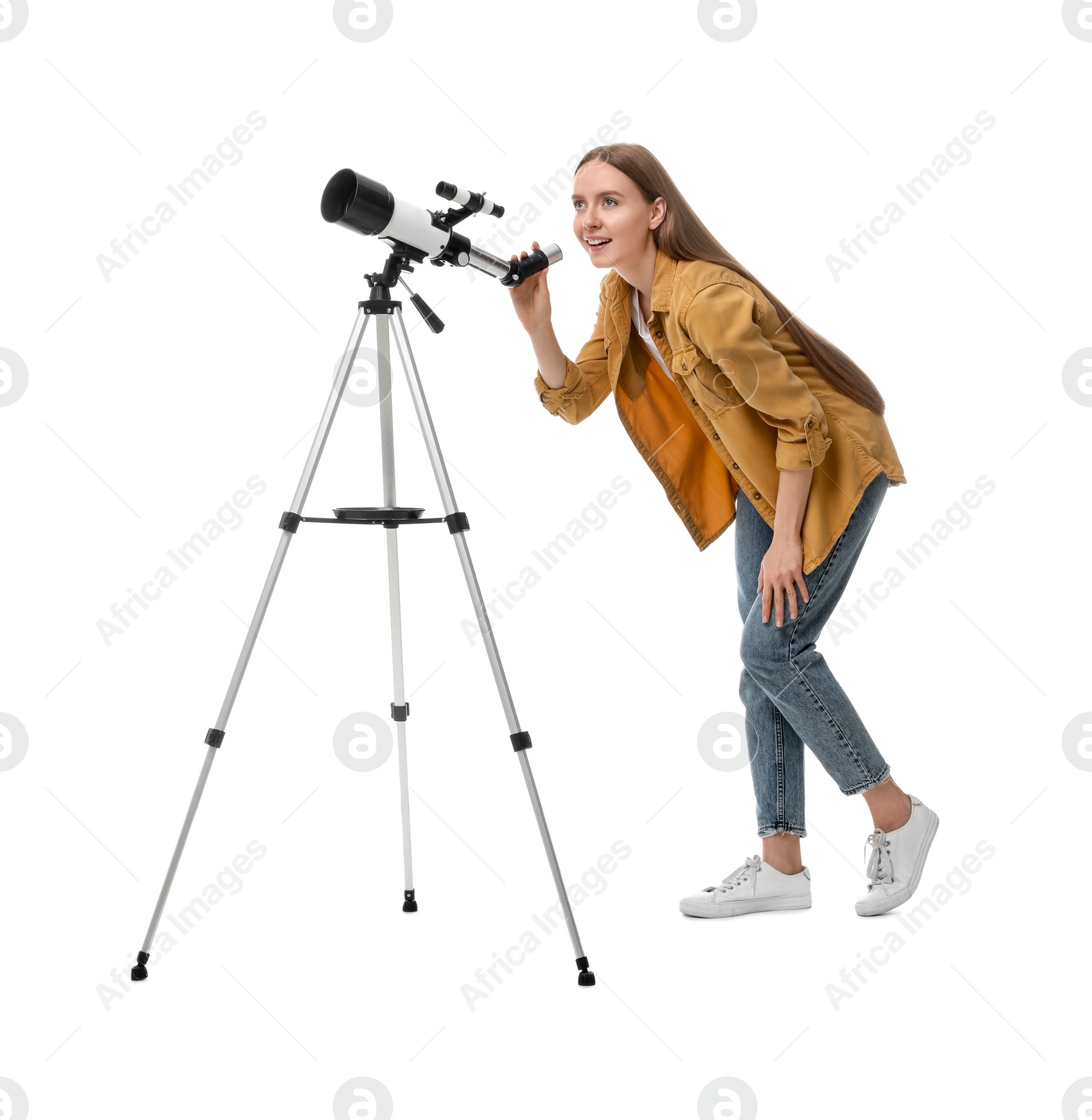 Photo of Young astronomer looking at stars through telescope on white background