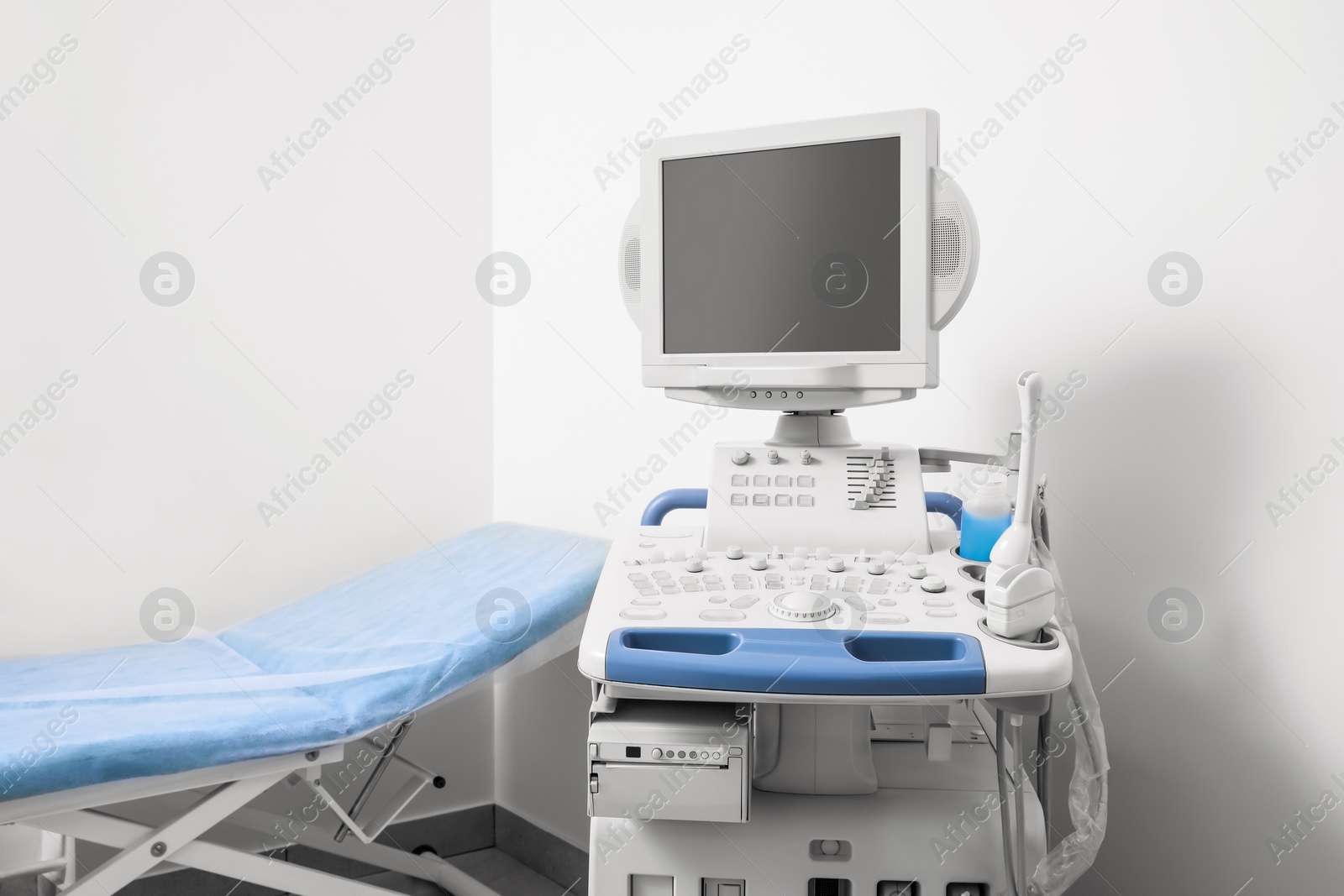 Photo of Ultrasound machine and examination table in hospital