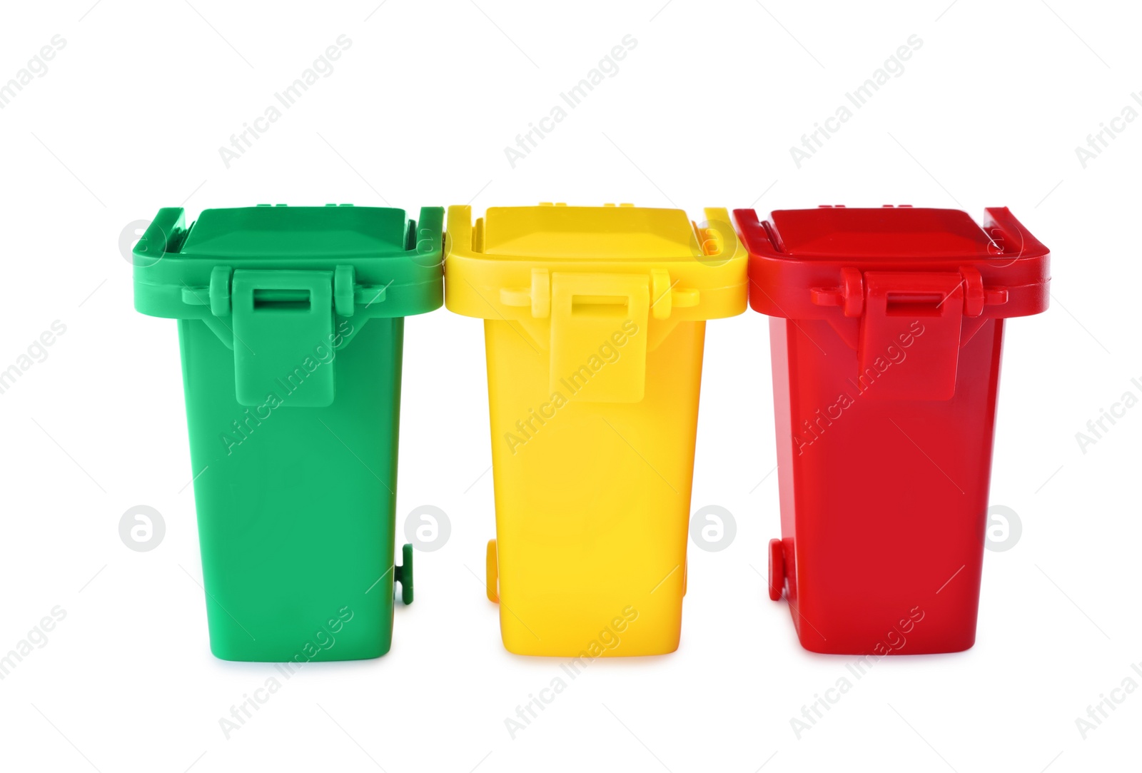 Photo of Mini color recycling bins on white background