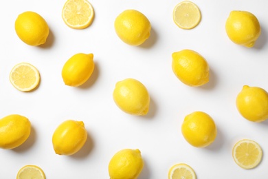 Photo of Beautiful composition with lemons on white background
