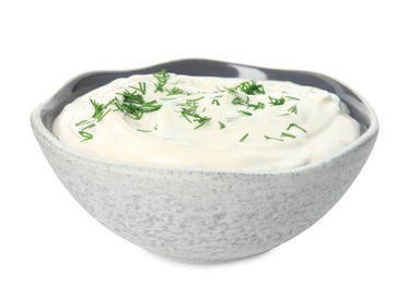 Tasty creamy dill sauce in bowl isolated on white