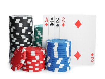 Photo of Playing cards and plastic casino chips on white background. Poker game