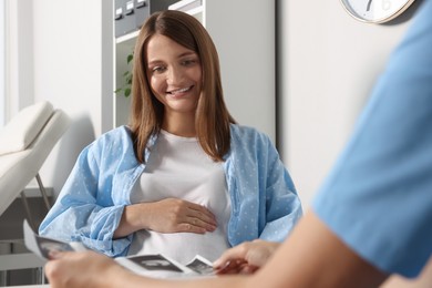 Photo of Pregnant woman having doctor appointment in hospital