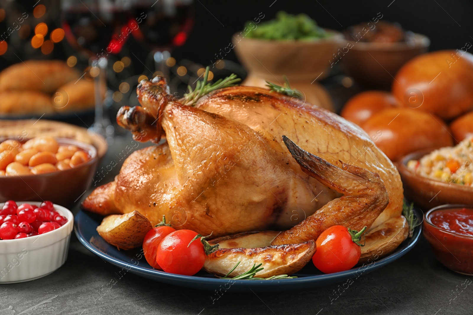 Photo of Traditional festive dinner with delicious roasted turkey served on table