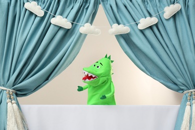 Creative puppet show on white stage indoors