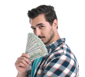 Handsome young man with dollars on white background