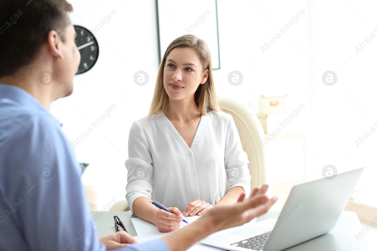 Photo of Human resources manager conducting job interview with applicant in office