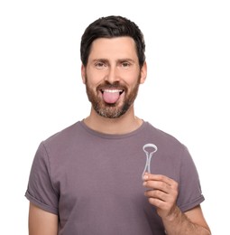 Photo of Happy man with tongue cleaner on white background