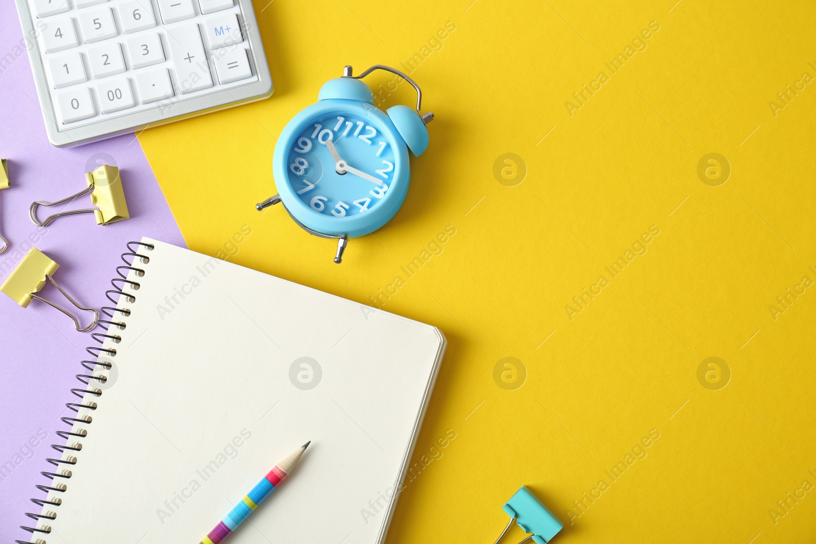 Photo of Flat lay composition with stationery on yellow background, space for text. Doing homework