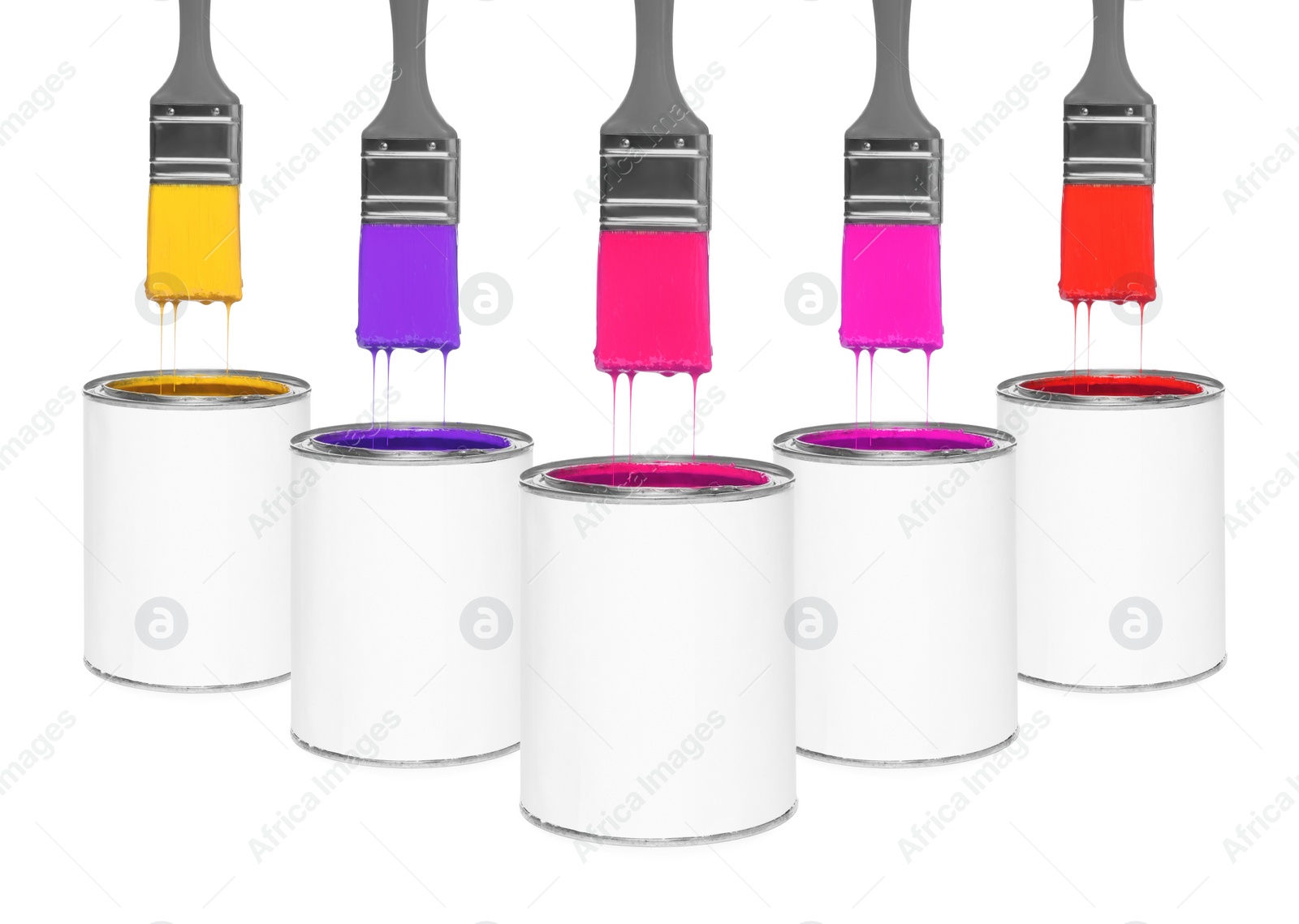 Image of Brushes with colorful paints in air over cans on white background