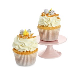 Photo of Tasty Easter cupcakes with vanilla cream isolated on white