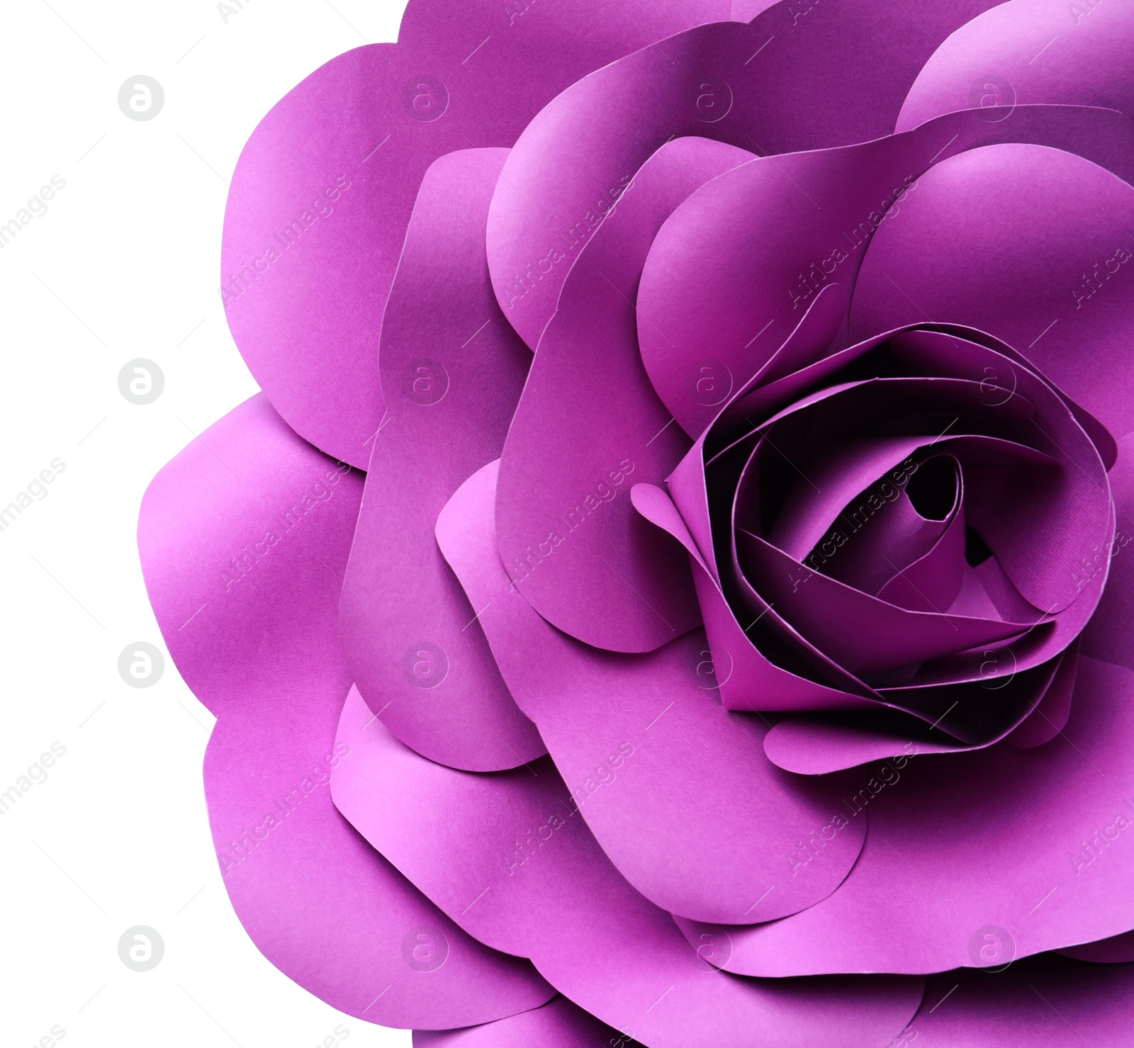 Photo of Beautiful purple flower made of paper on white background, top view