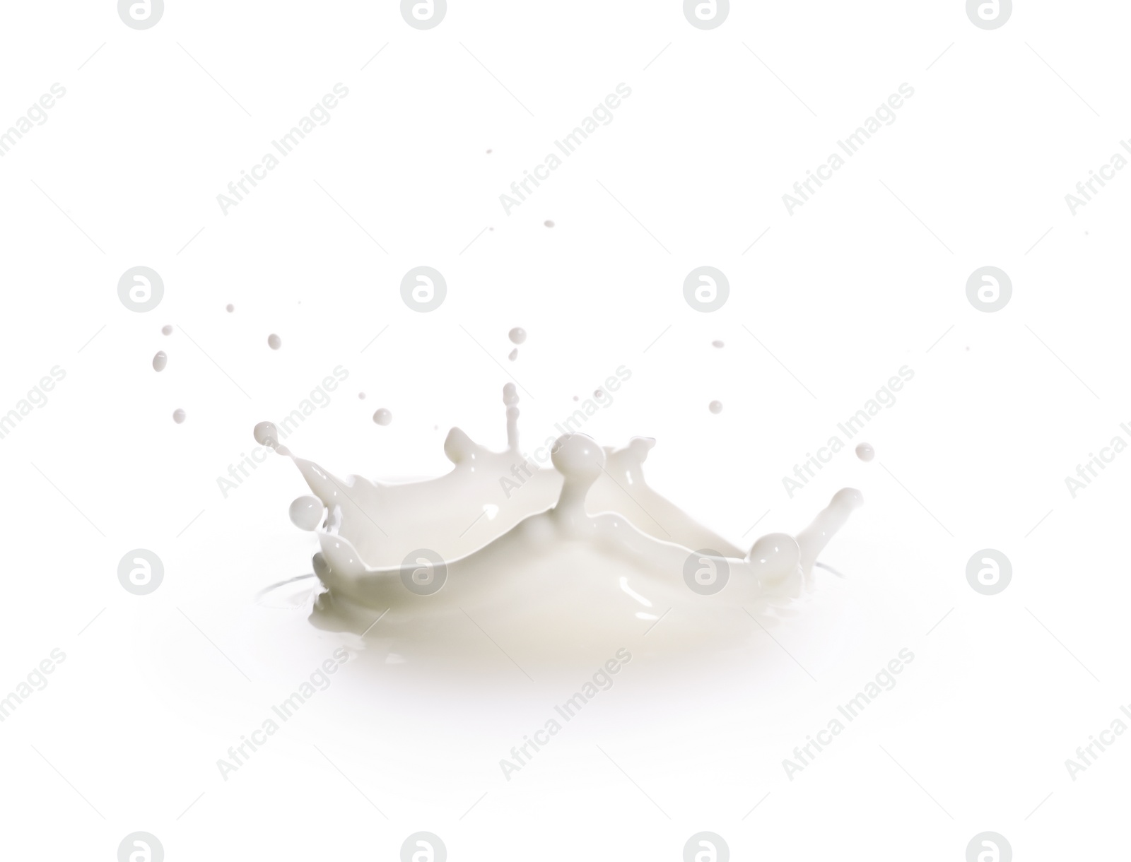 Photo of Splash of fresh milk on white background