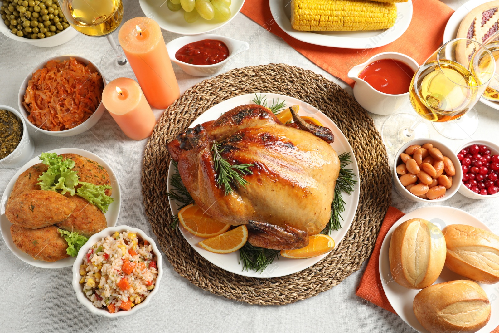 Photo of Delicious festive dinner with roasted turkey on table, flat lay