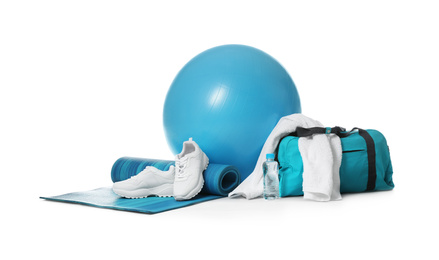 Photo of Fitness ball, gym bag and sport accessories isolated on white
