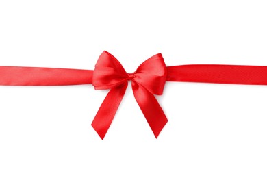 Photo of Red bow and ribbon on white background, top view