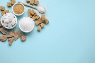 Photo of Different types of sugar on turquoise background, flat lay. Space for text