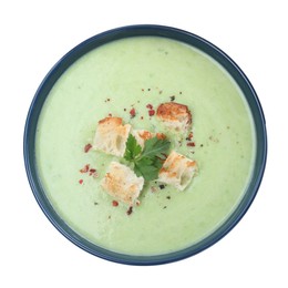 Delicious asparagus soup with croutons and parsley on white background, top view