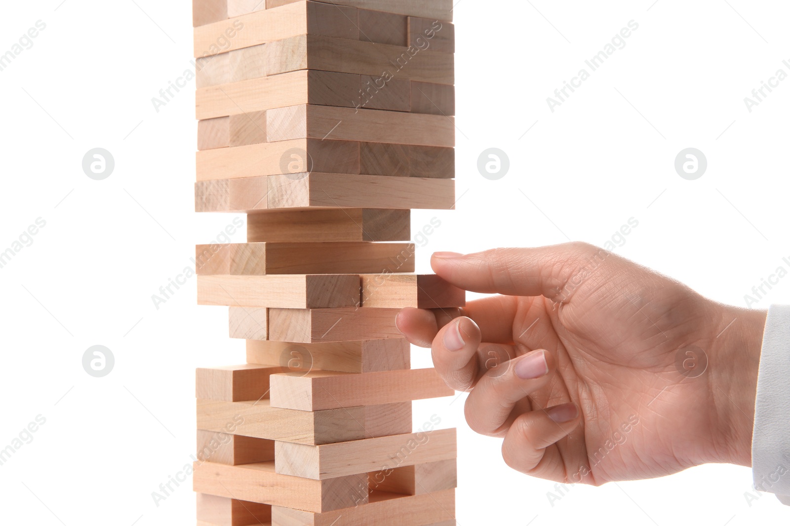 Photo of Woman playing Jenga on white background, closeup