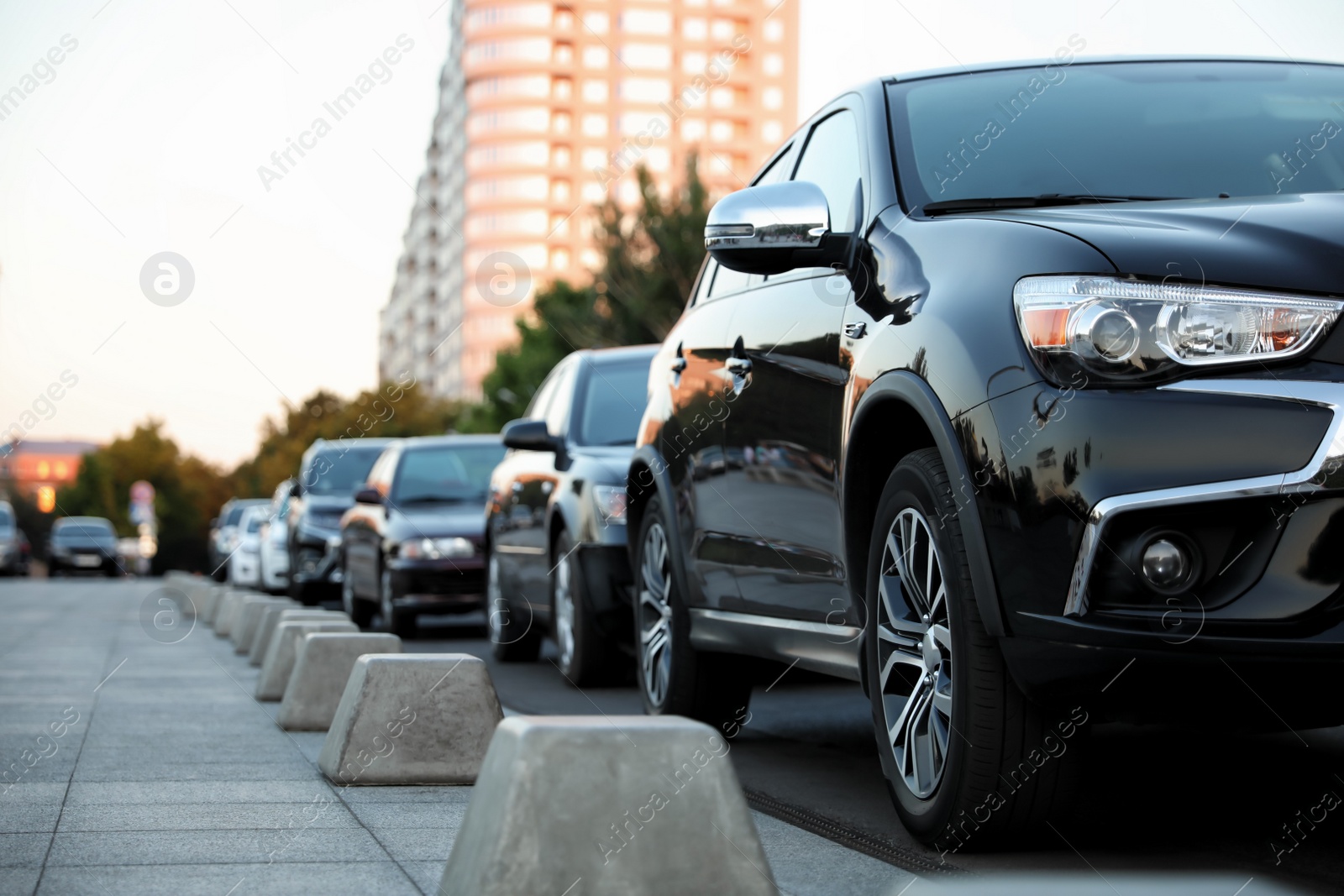 Photo of Black modern car parked on city street