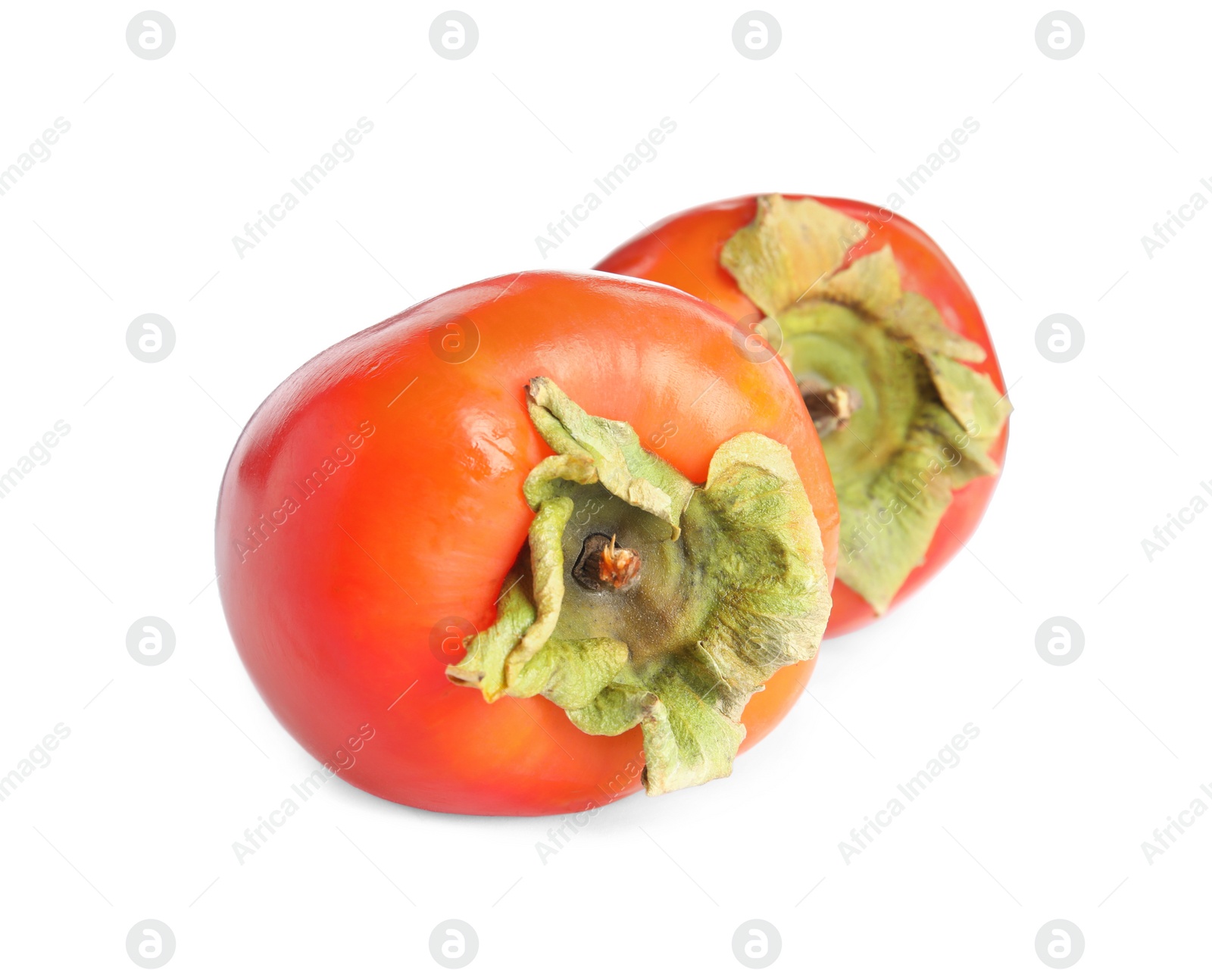 Photo of Delicious fresh ripe persimmons isolated on white