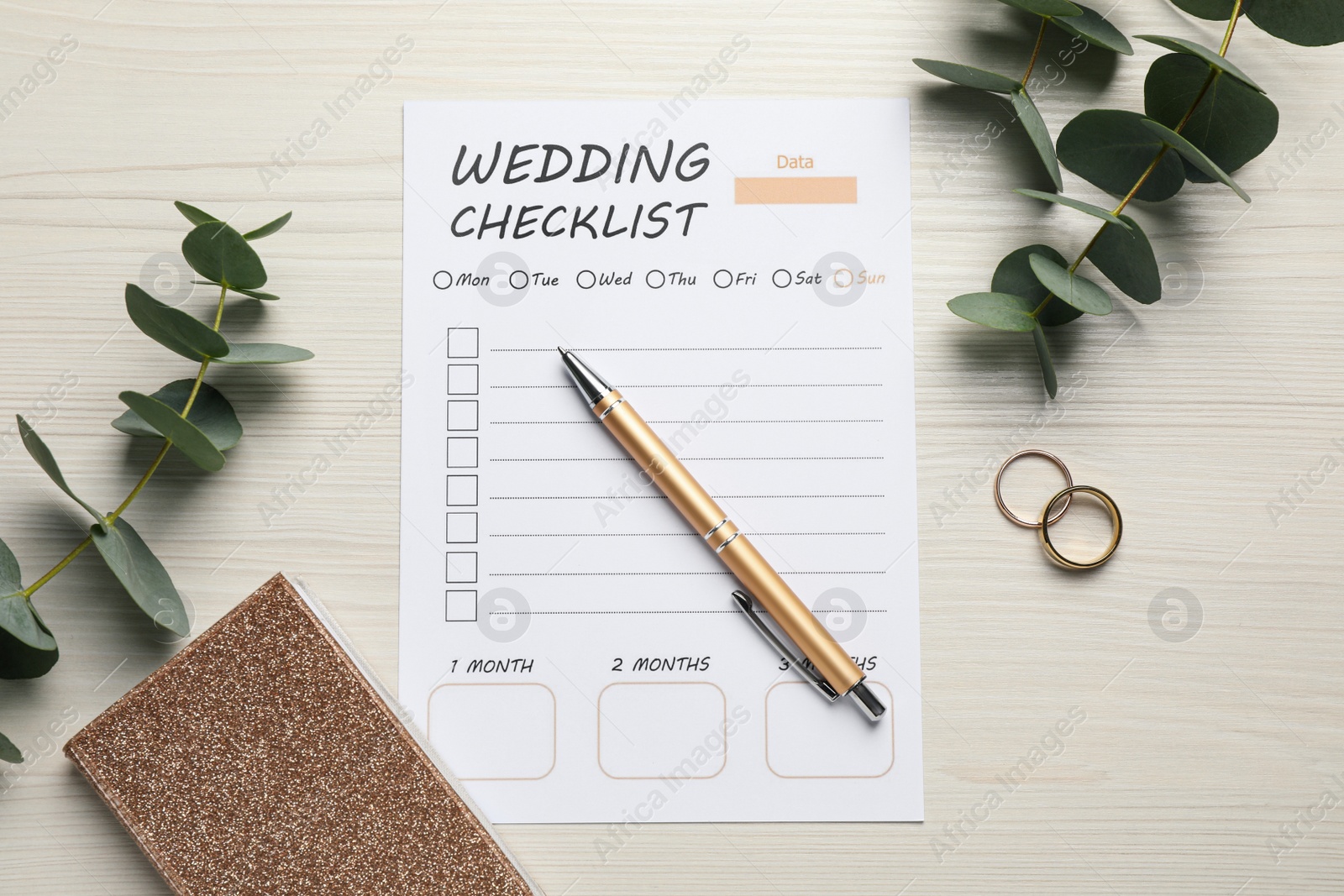 Photo of Flat lay composition with Wedding Checklist and planner on white wooden table