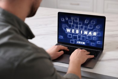 Image of Online webinar, web page on computer screen. Man using laptop at light table, closeup