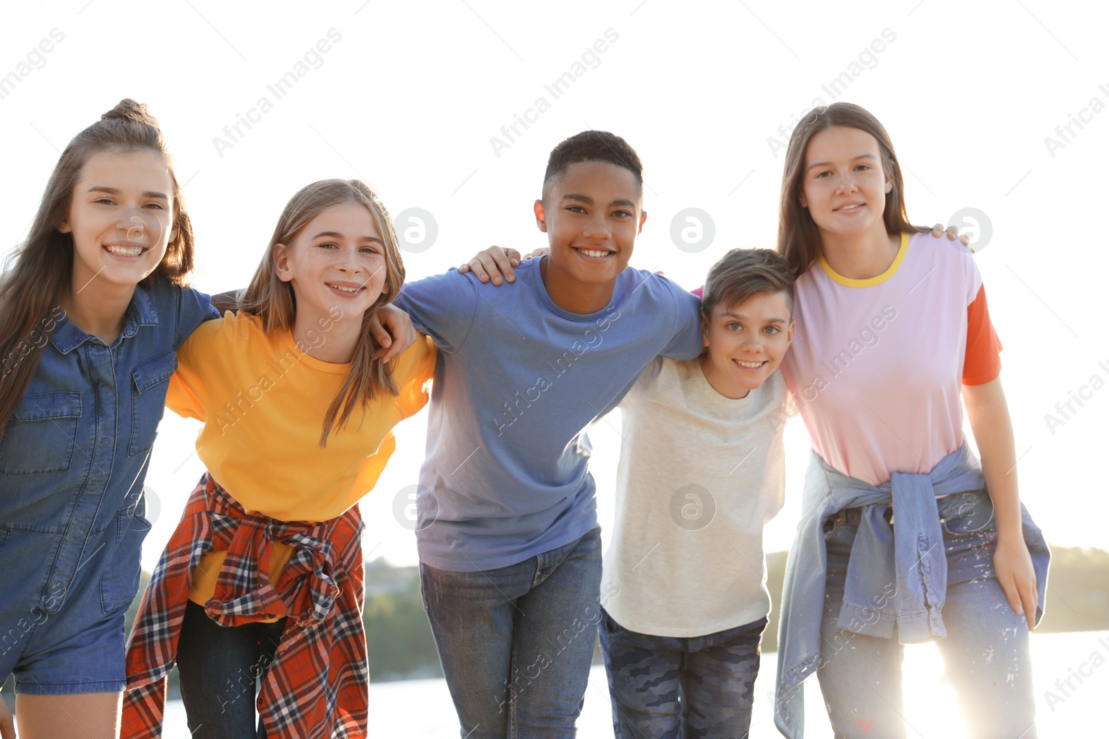 Photo of Group of children outdoors on sunny day. Summer camp