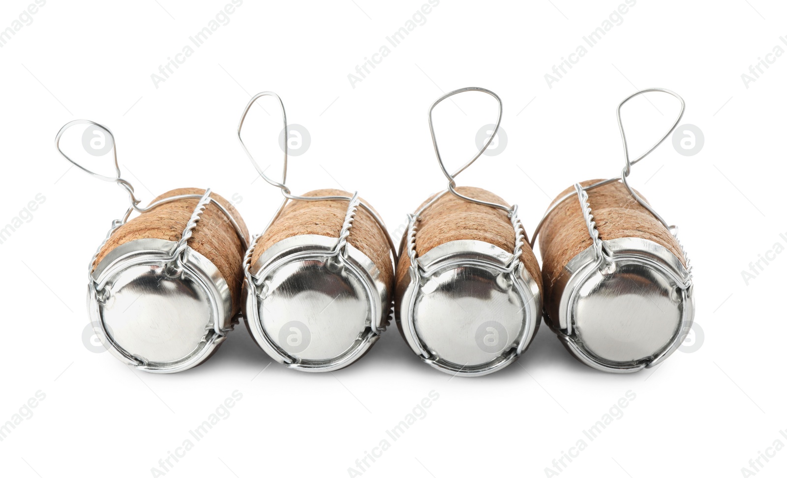 Photo of Sparkling wine corks with muselet caps on white background