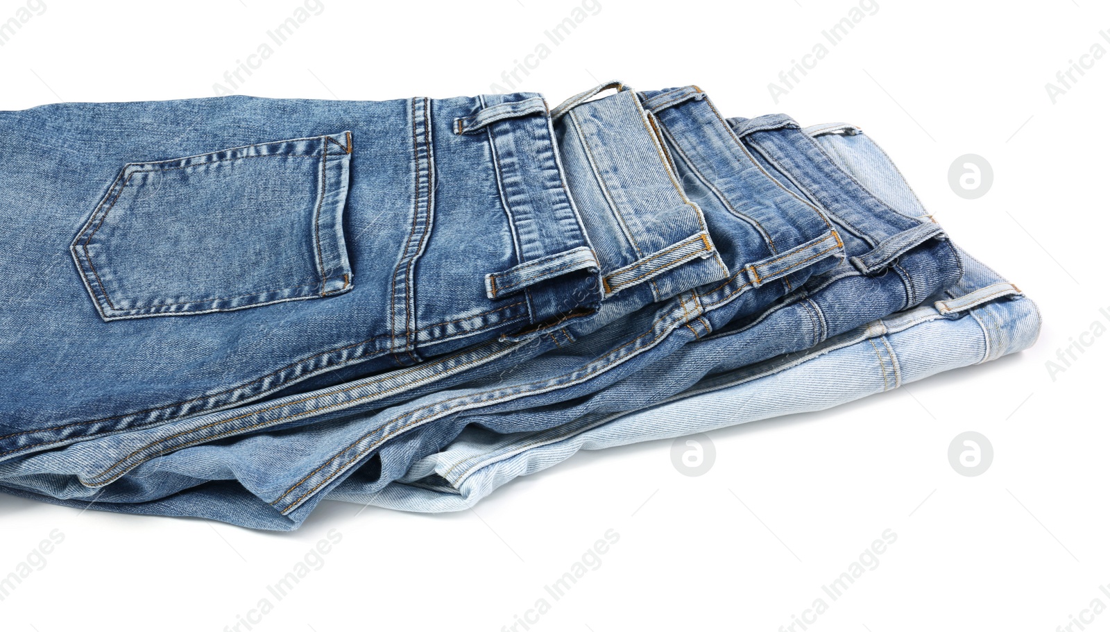 Photo of Different stylish blue jeans isolated on white