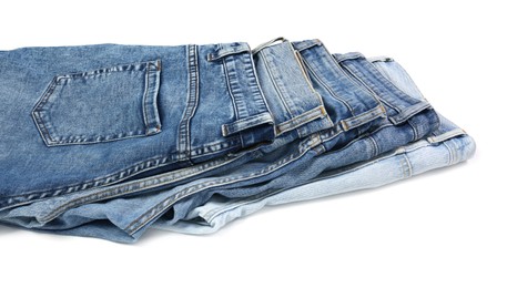 Different stylish blue jeans isolated on white