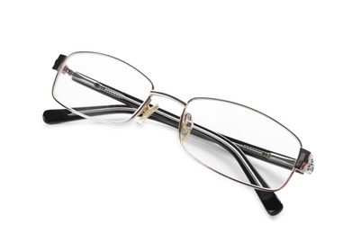 Photo of Glasses with corrective lenses on white background. Vision problem