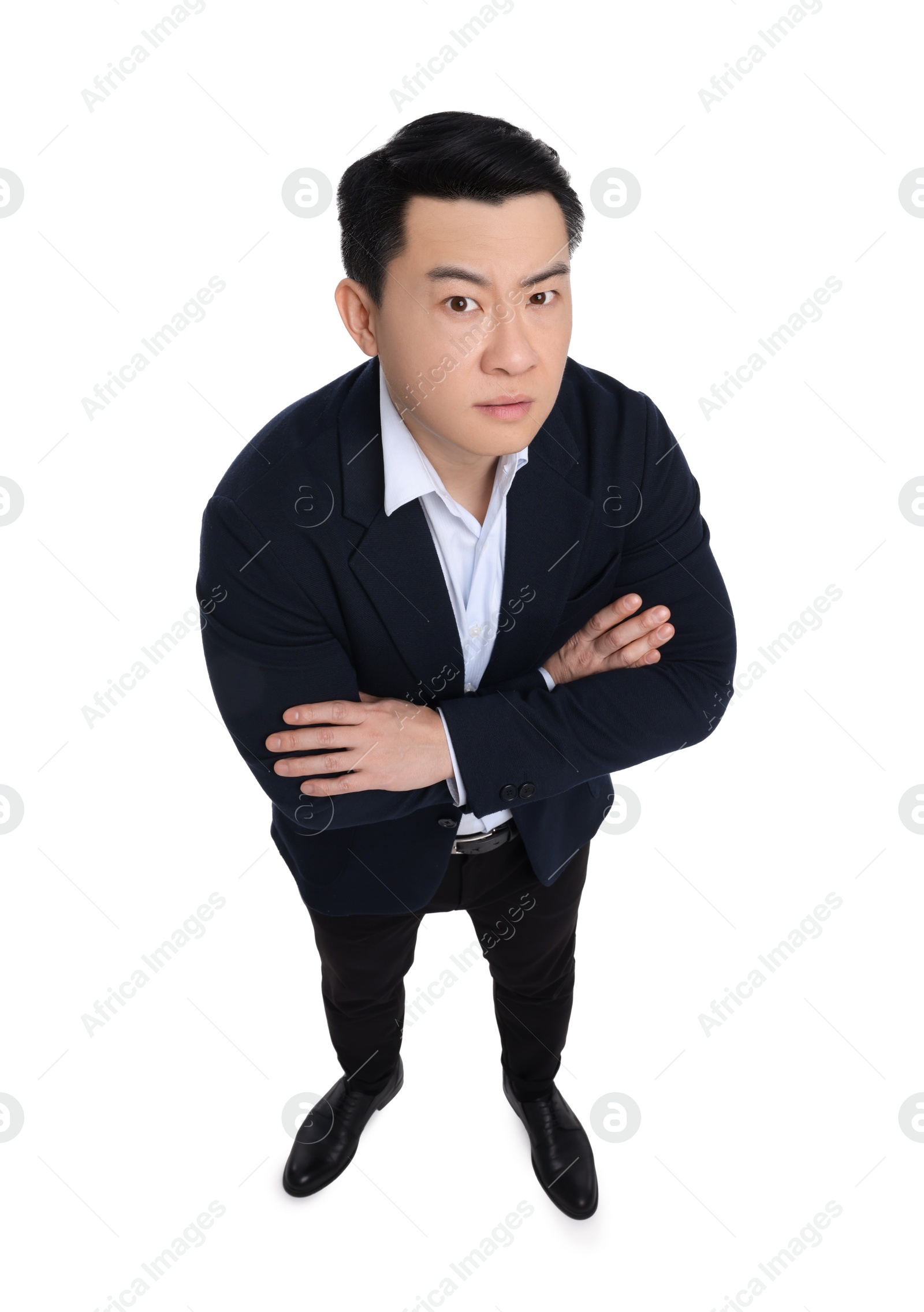 Photo of Businessman in suit posing on white background, above view