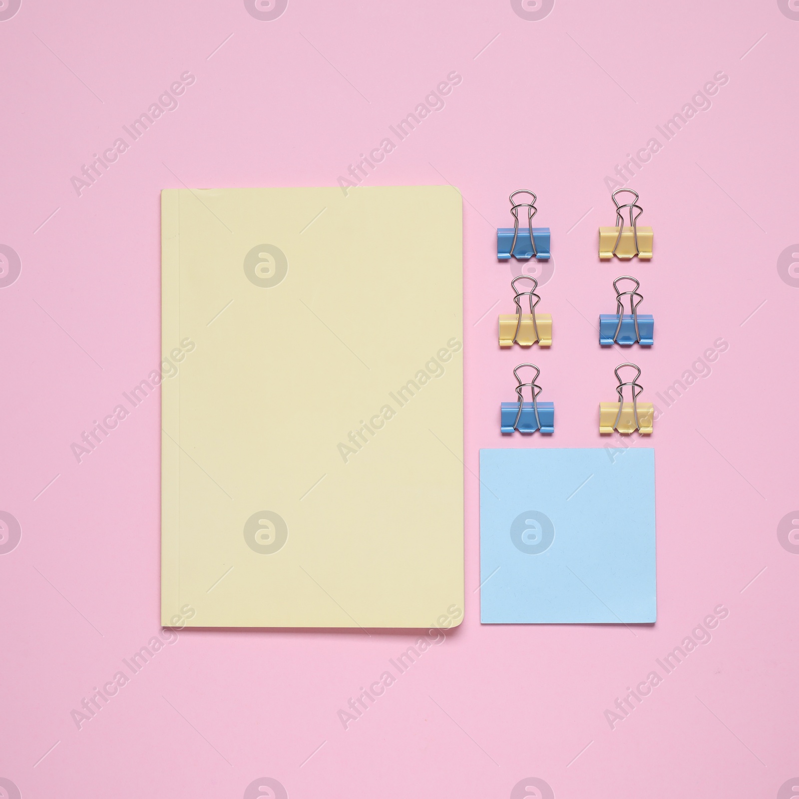 Photo of Different stationery on pink background, flat lay