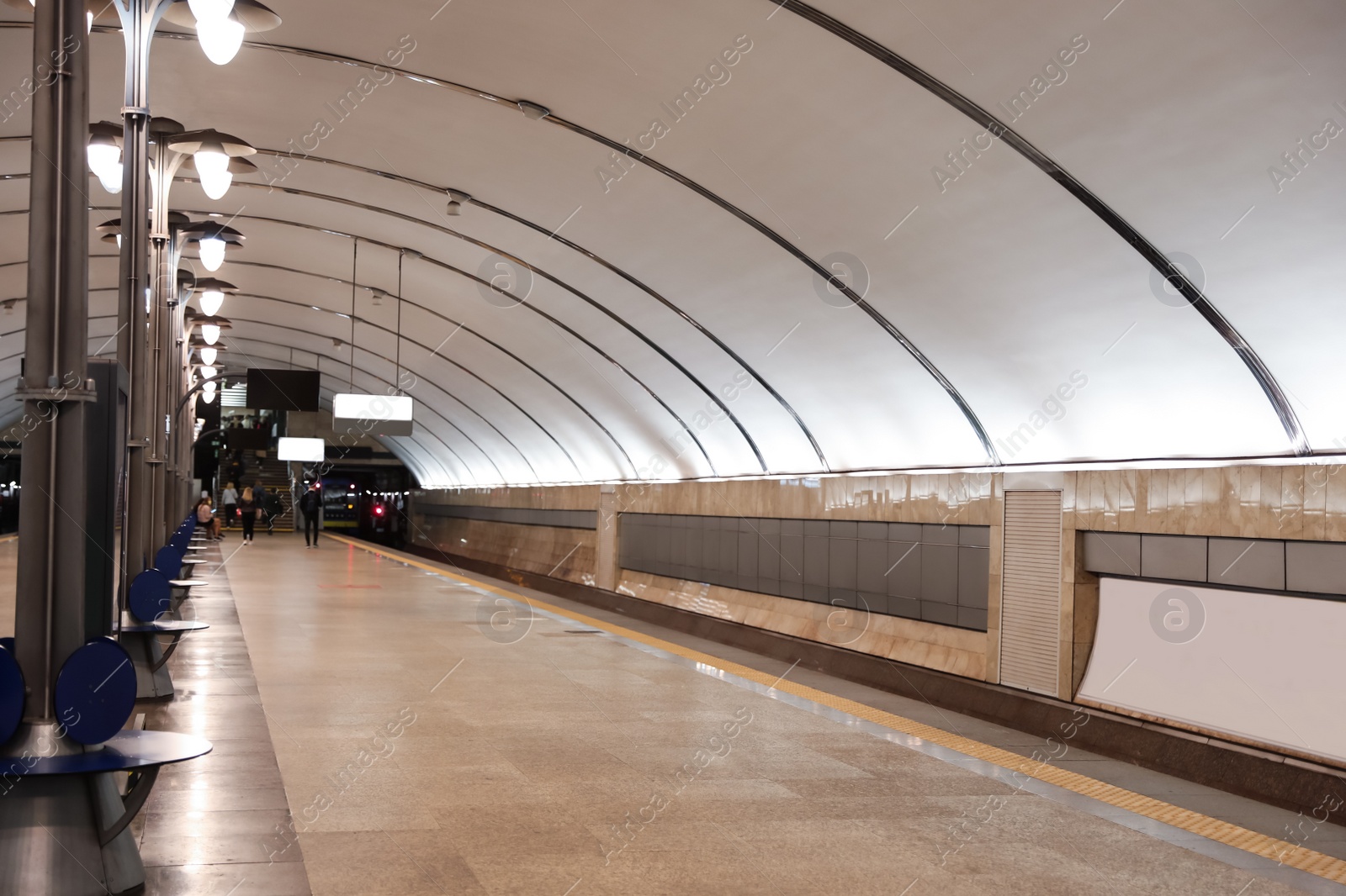 Photo of Spacious subway station with sitting places. Public transport