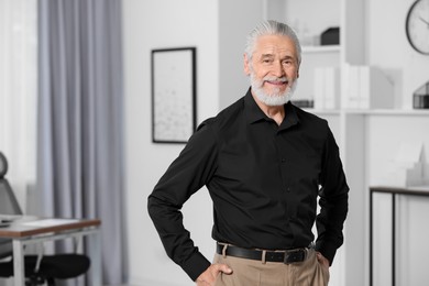 Photo of Portrait of handsome senior man in black shirt at home. Space for text