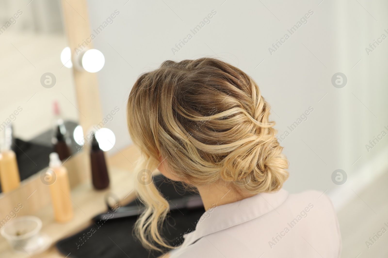 Photo of Woman with beautiful hair style in salon