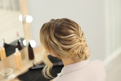 Photo of Woman with beautiful hair style in salon