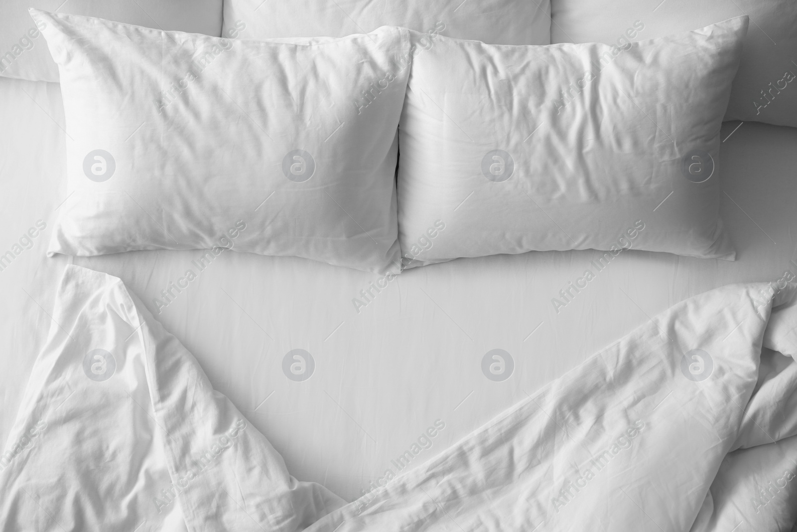 Photo of Soft pillows on comfortable bed, top view