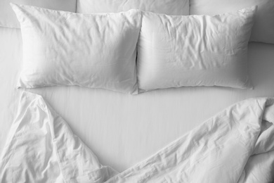 Photo of Soft pillows on comfortable bed, top view