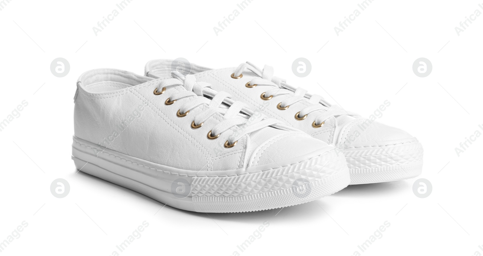 Photo of Pair of stylish sneakers on white background