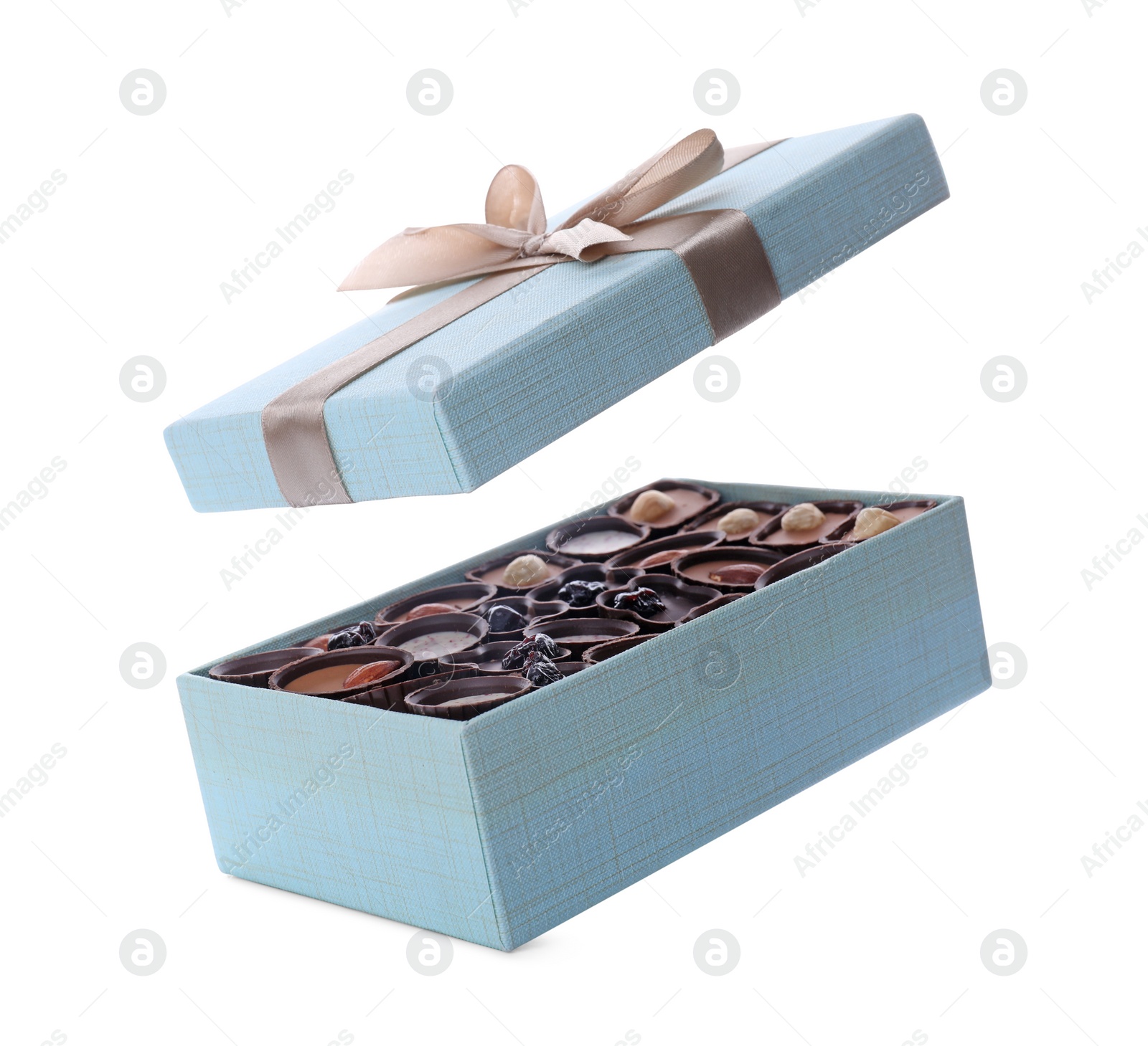 Photo of Box of delicious chocolate candies isolated on white